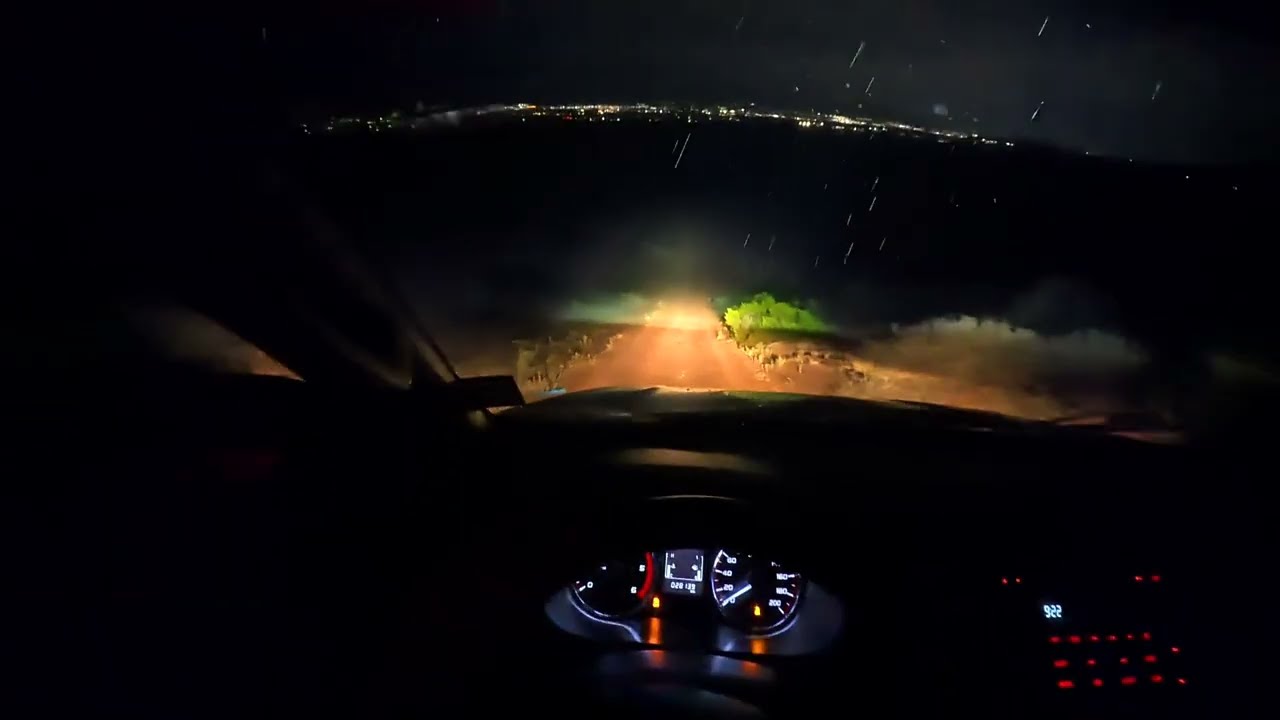 POV Driving Mitsubishi Diesel 4x4 Manual Trans Truck in the desert rain