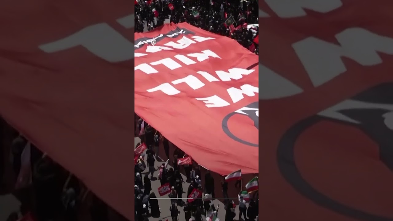 Crowds in Mashhad hold 'We will kill Trump' banner ahead of Khamenei burial