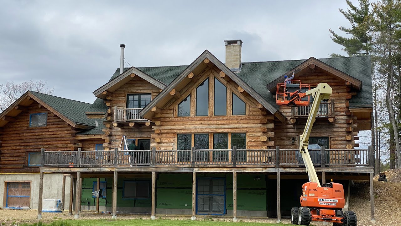 Staining and chinking log home in Massachusetts￼