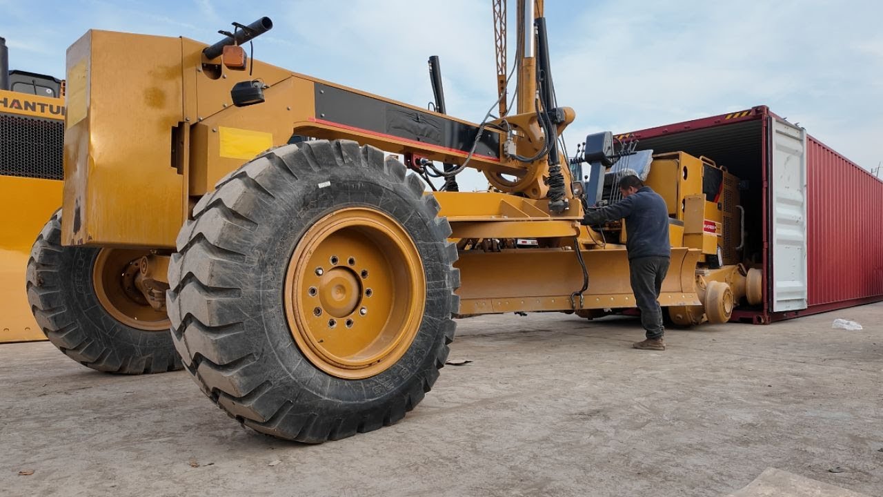 Loading a Giant Grader with a Monster Excavator
