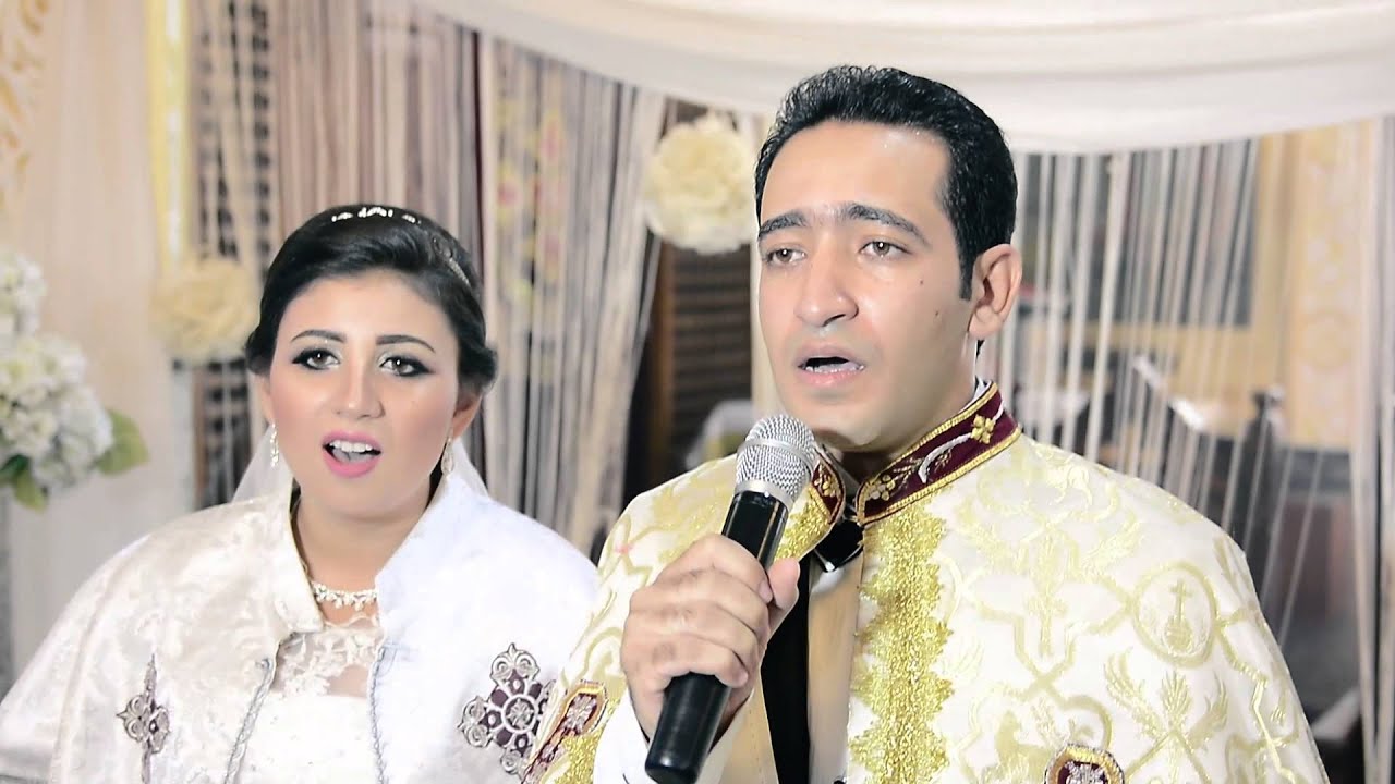 العريس والعروسة يشاركان فى لحن اجيوس الفرايحى .. مينا قرياقص وعروسه
