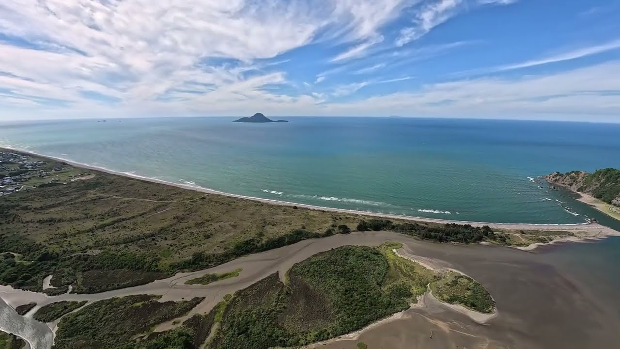Take in the sights of New Zealand's stunning East Coast from a paragliding perspective.