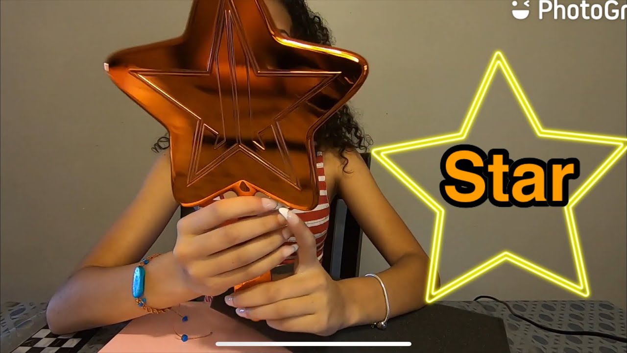 Jeffree Star classic star hand mirror with an orange electric chrome finish!