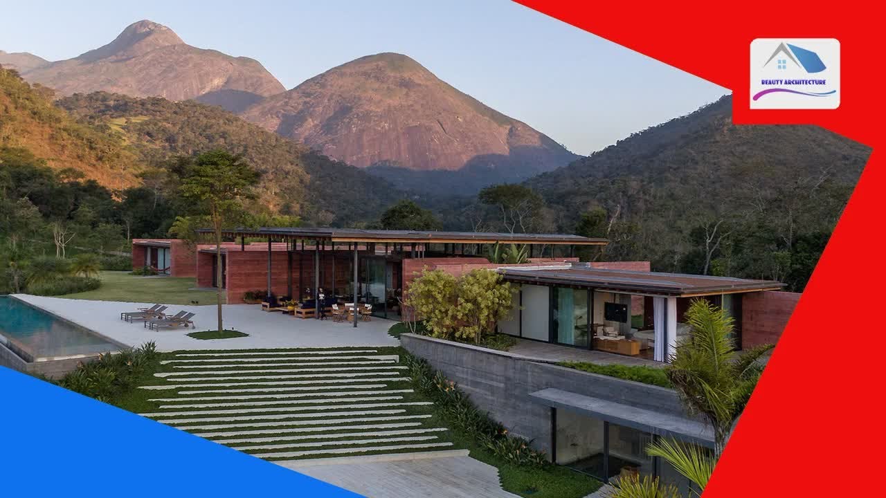 Terracotta-tinged walls match the surrounding mountains in Bernardes Arquitetura's Casa Terra - Beau