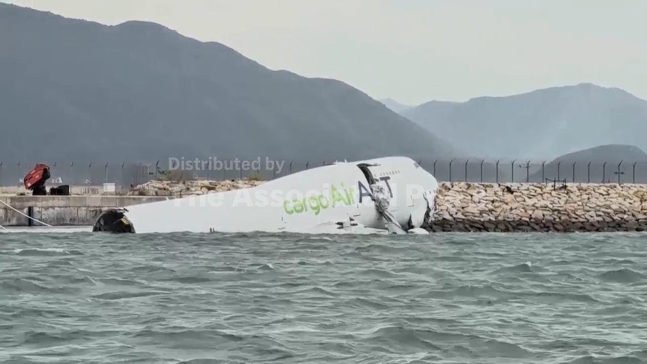 Cargo aircraft skids off Hong Kong runway, collides with security patrol car, killing 2, AP explains