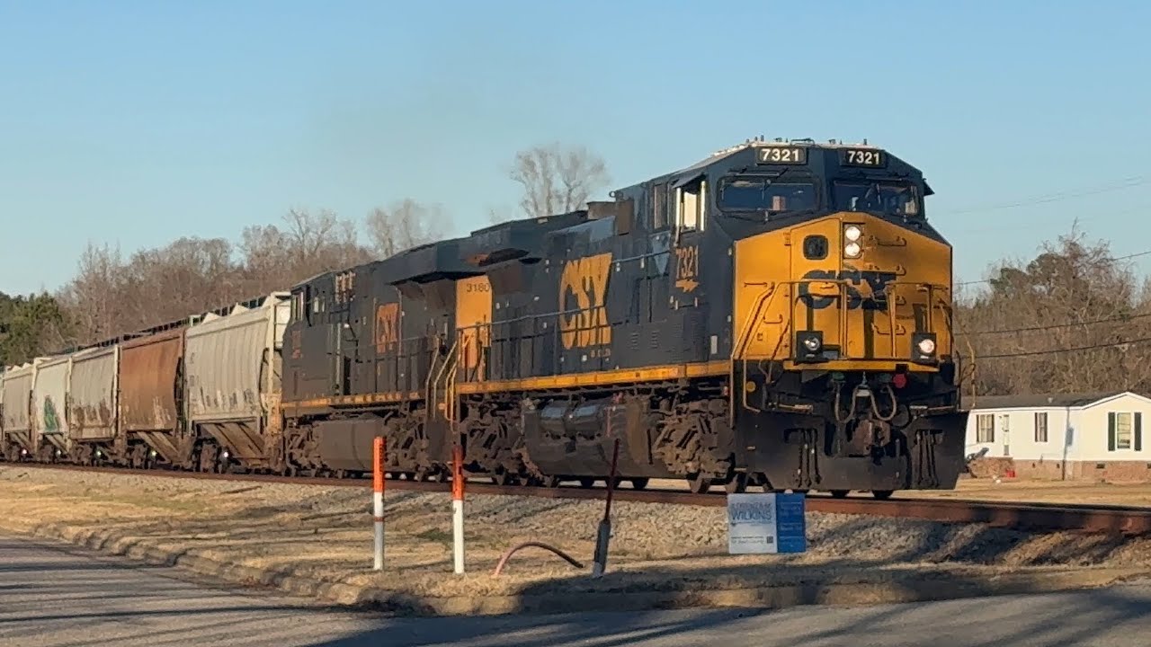 CSX loaded grain CM44AC 7321 ES44AH 3180 seen at Whitakers bound to Turkey NC w/ horn salute