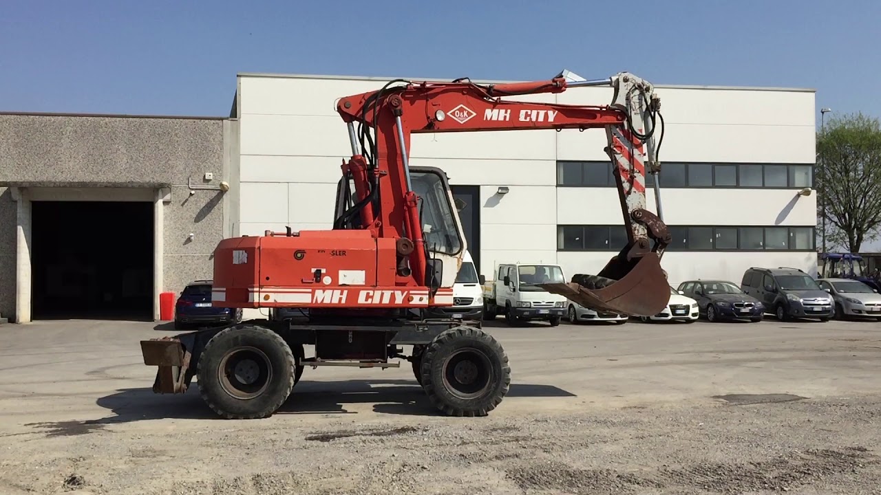 Escavatore gommato O&K MH City
