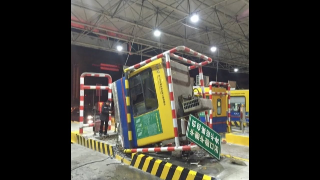 Tollbooth Kiosk Upended by Overloaded Truck in East China City