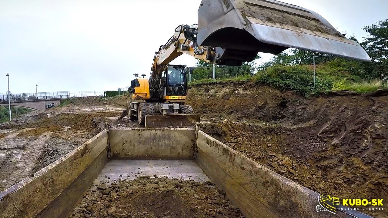Liebherr A918 excavator digging clay and loading Tatra Terrno1 tipper truck