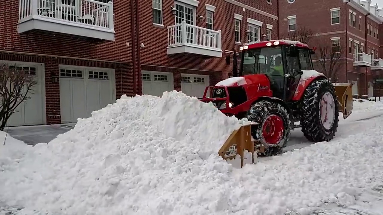 Kubota M126 Plowing Snow