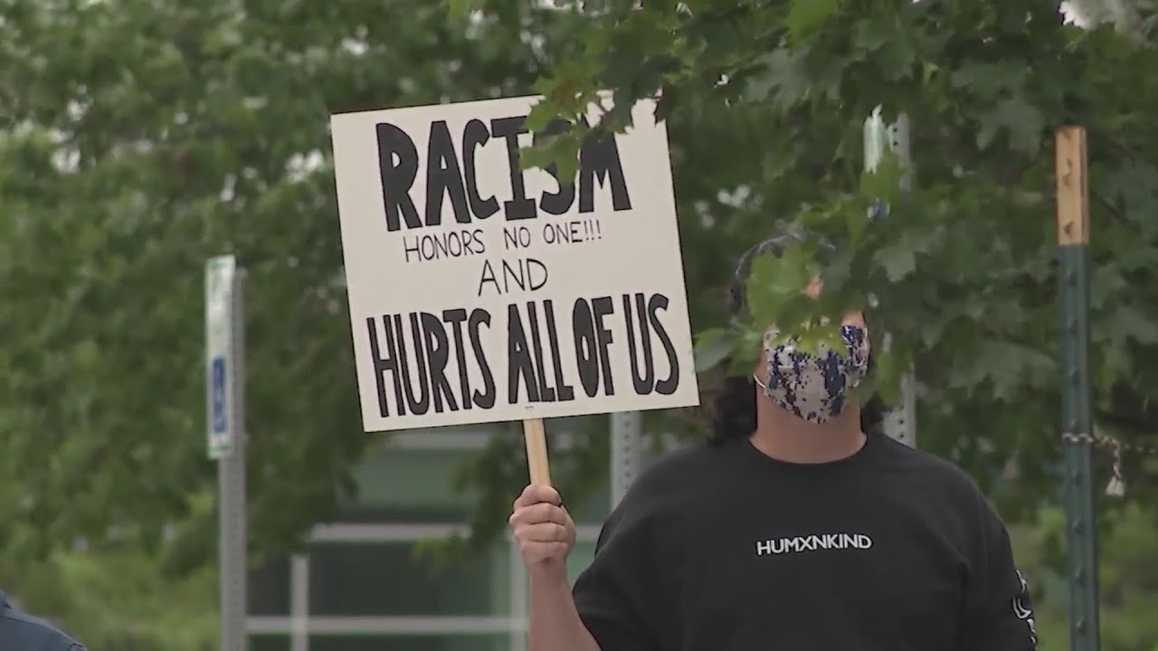 Protesters gather outside Olathe Public Schools after student says he was racially insulted