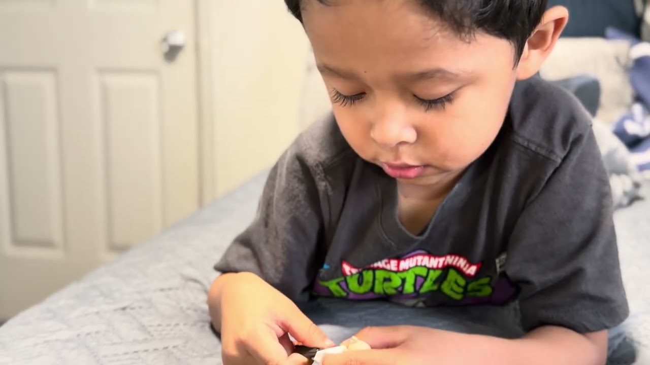 Building his toy bird 