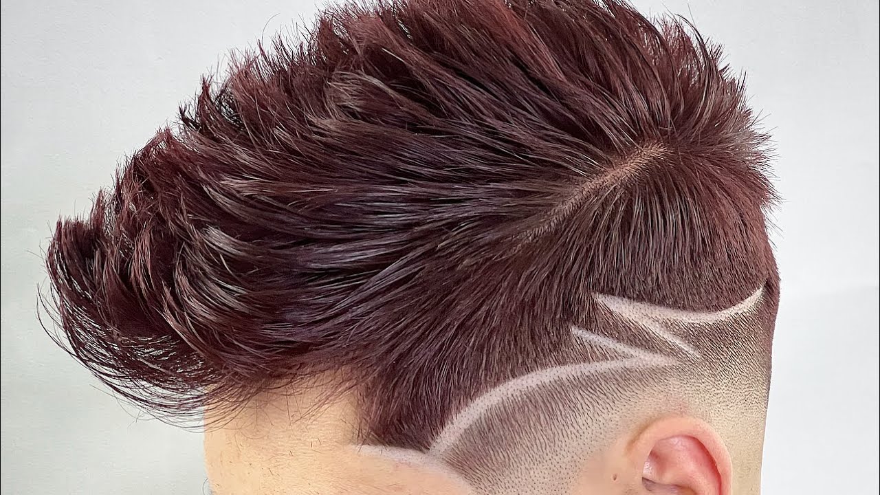 Corte desvanecido más diseño y peinado