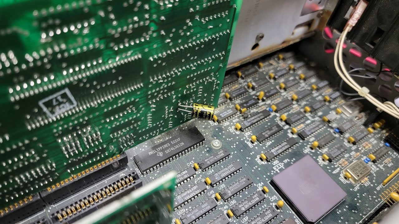 Fixing a ISA controller card by replacing a capacitor.