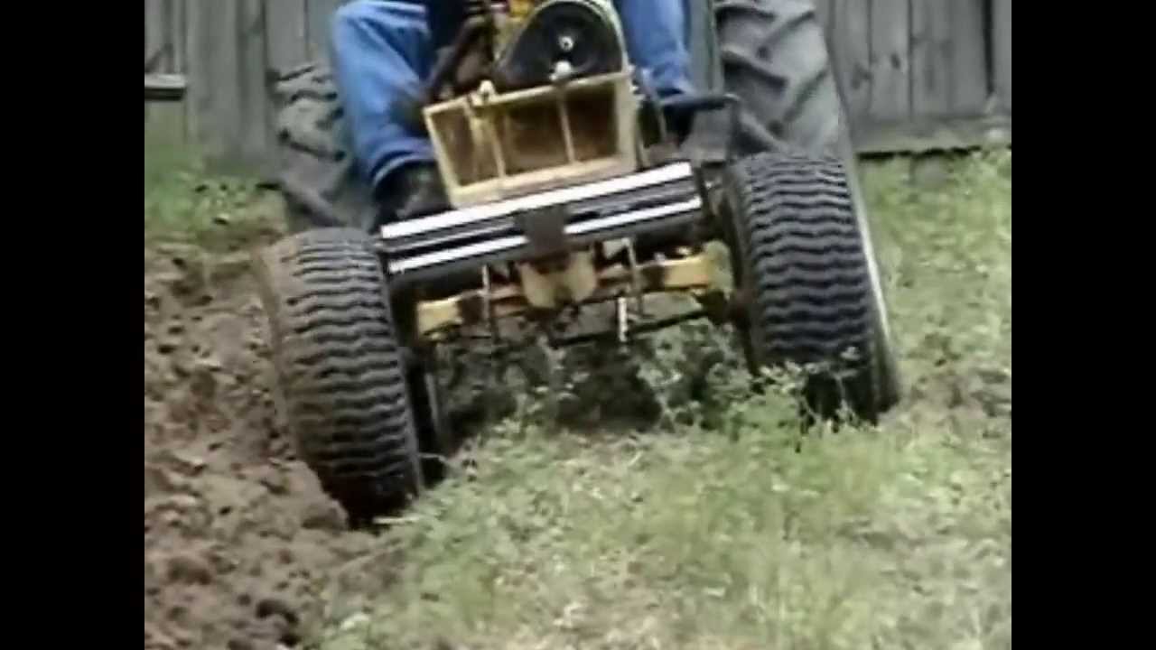 ST16 Sears Tractor Plowing a Garden