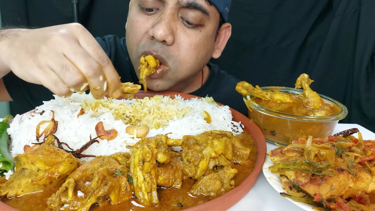 chicken legs spicy curry eating with kaju rice