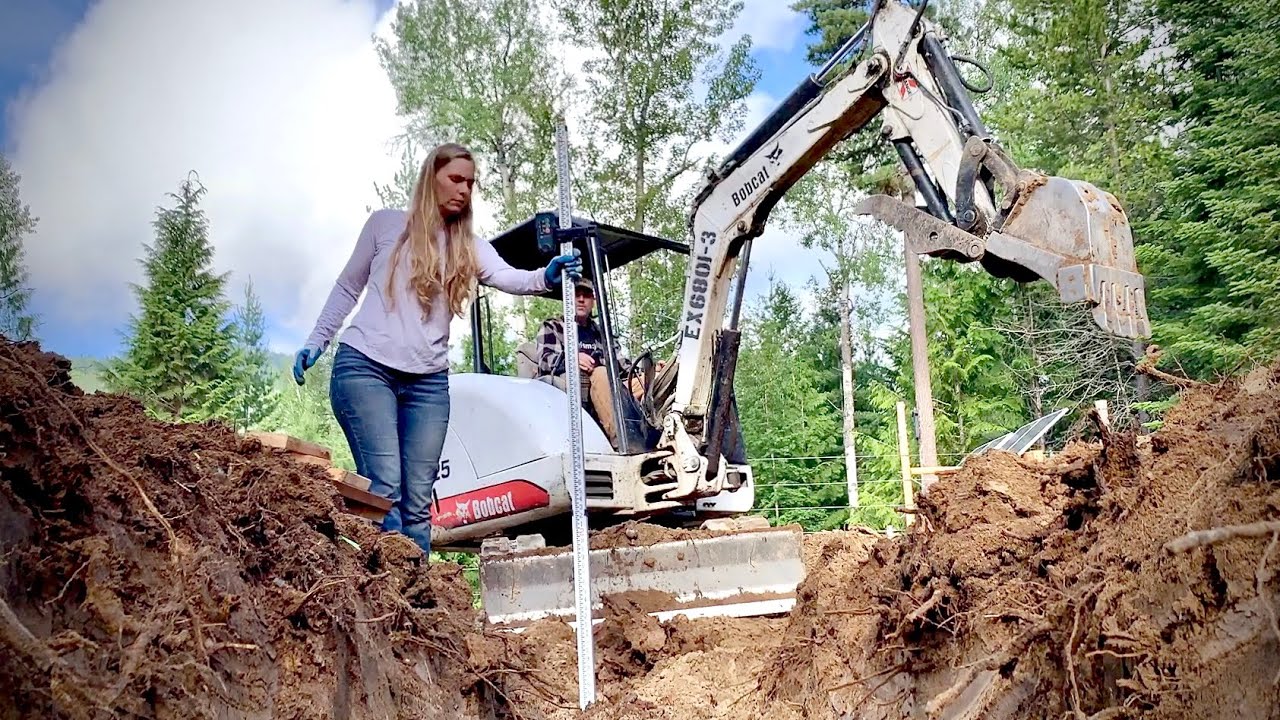 Couple Builds Off Grid Dream Home - Digging Footers for the Garage