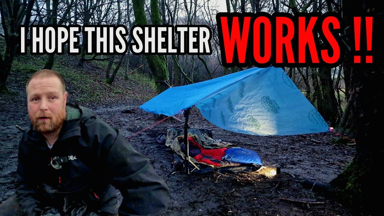 CAMPING IN RAIN under a self made shelter.
