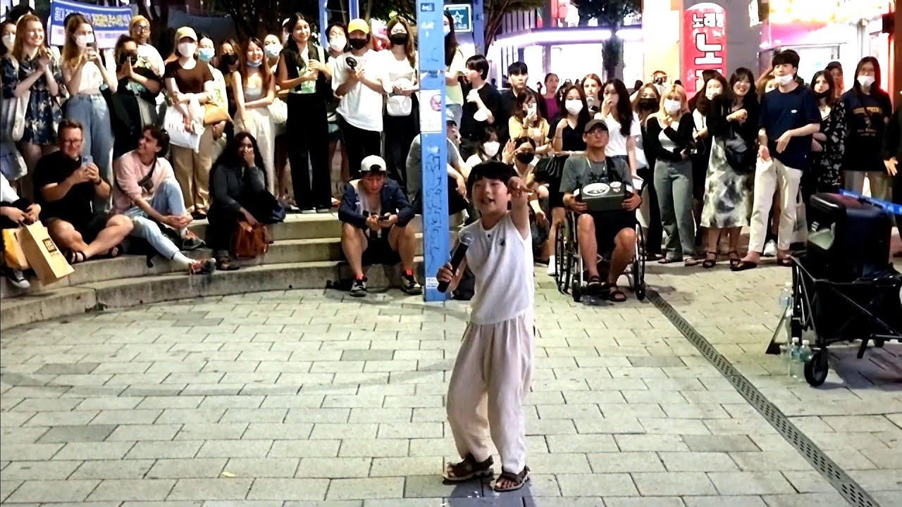FRIDAY. HYOJIN. GUEST: CUTE LITTLE BOY. ENJOYING IMPROMPTU EXHILARATING HONGDAE BUSKING.