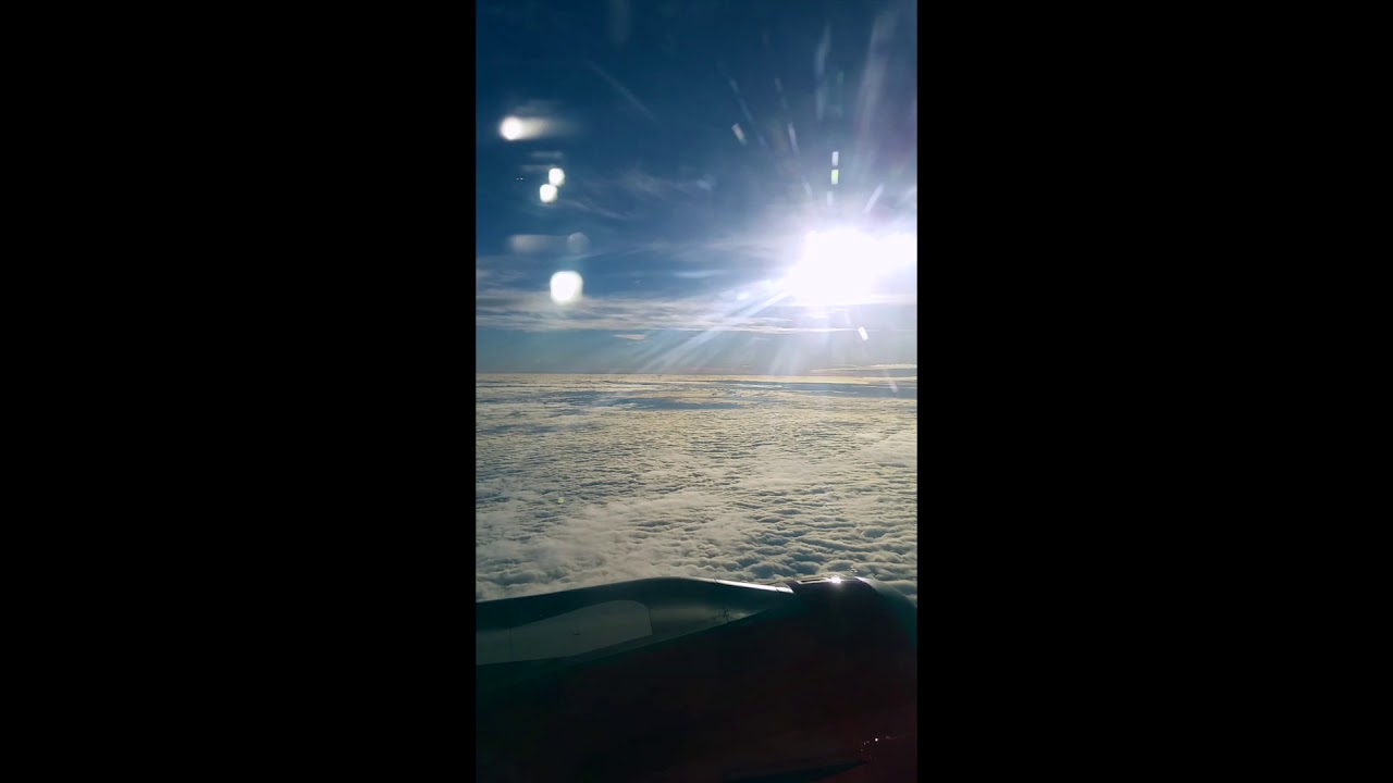 Airplane flying sea and sky to denmark