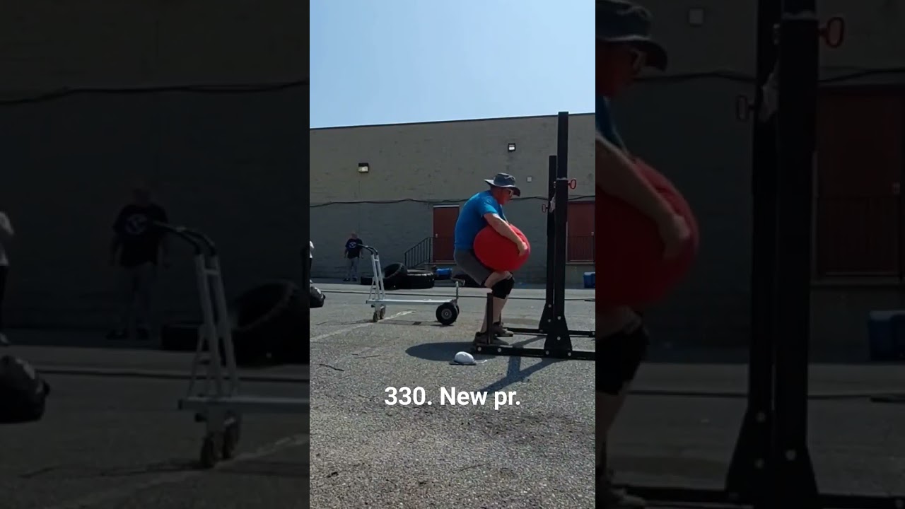 330 sandbag over bar #strongman