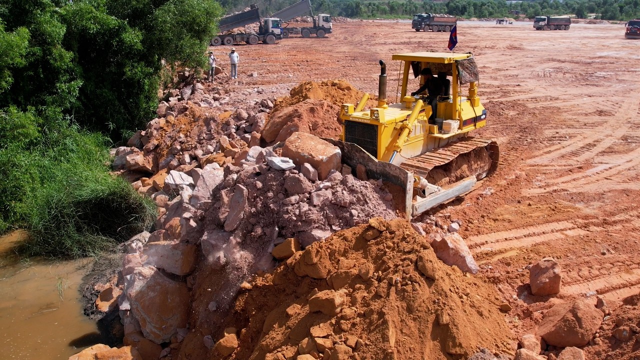 Huge Project- Land Reclamation Process Bulldozer Move Rock Clearing Level, Dump Truck Dumping Rock