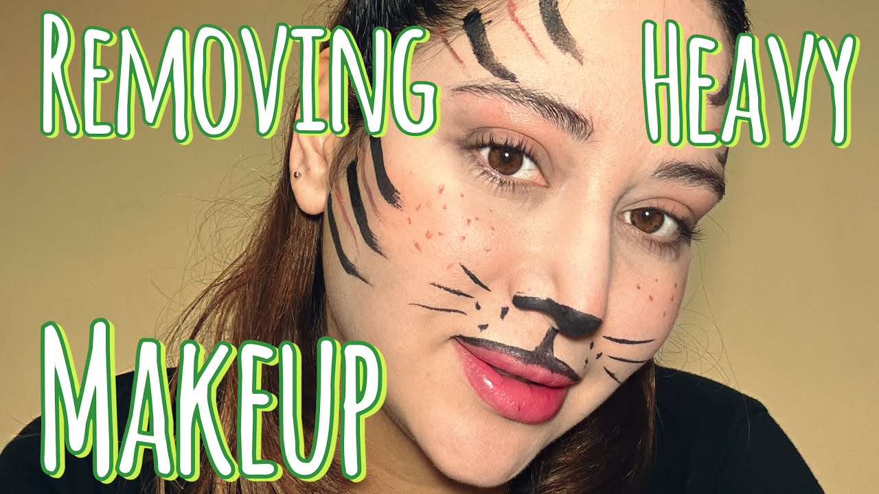 Clean heavy makeup of face 