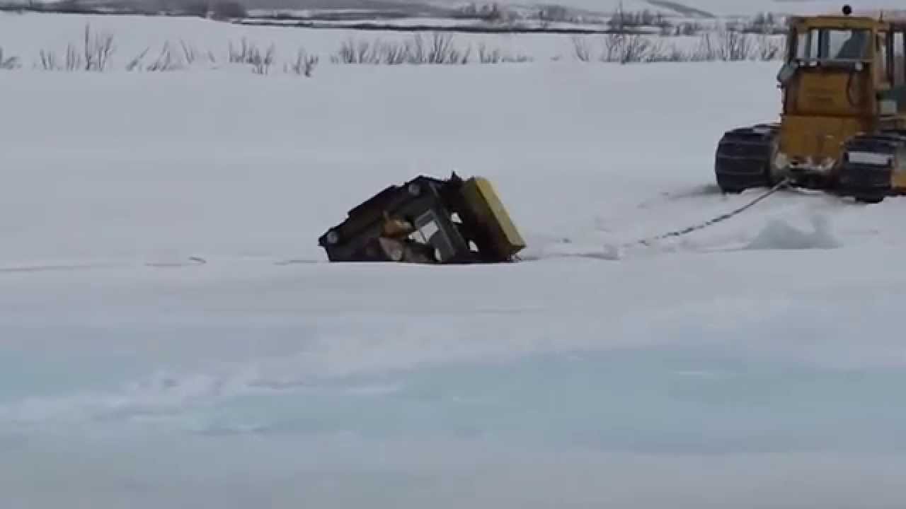 T-170 dozer sinks through the ice
