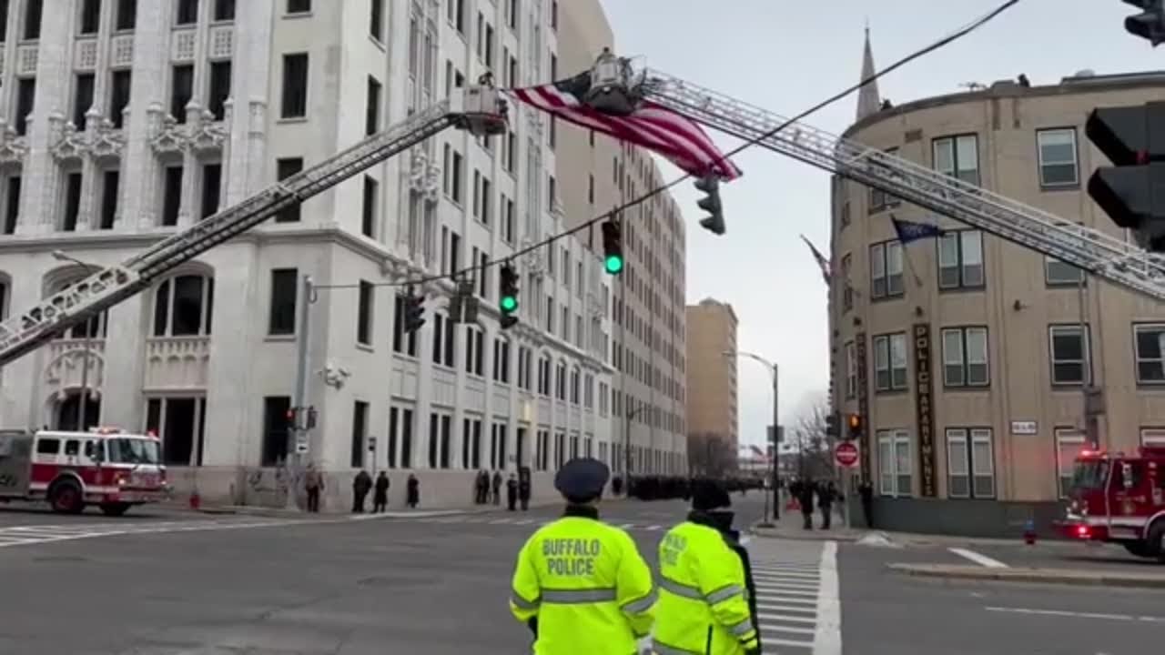 American Flag hangs over Church Street for funeral procession for Jason Arno