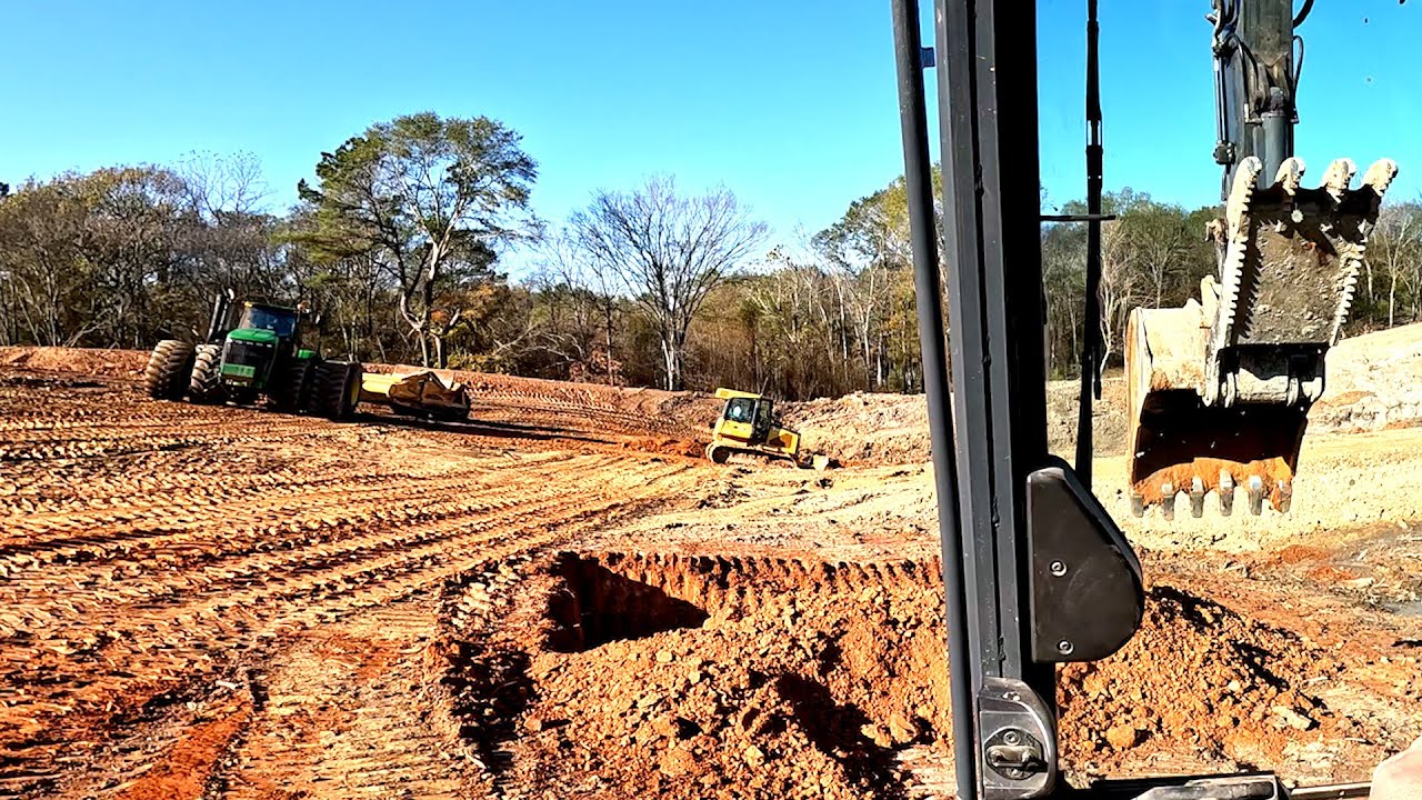 Installing a pond dam core on the largest pond we have ever built. Part 1.