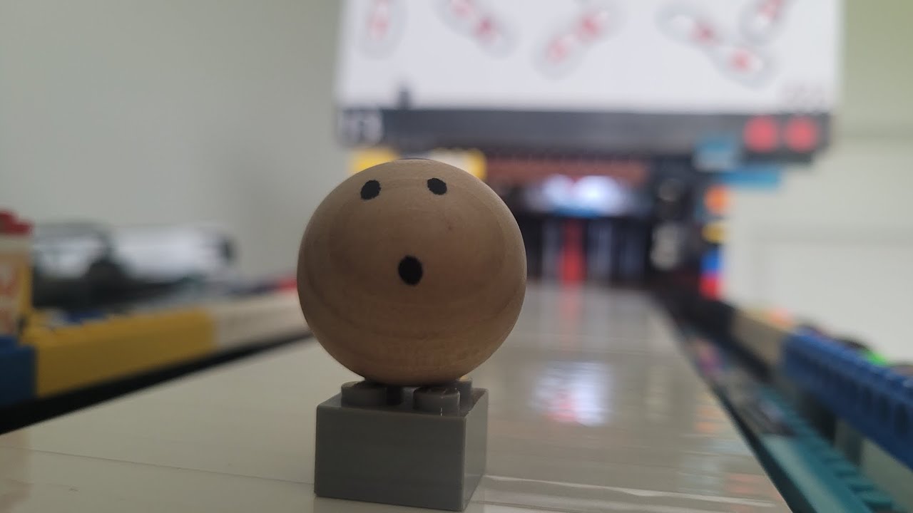 Bowling with a mini wooden bowling ball
