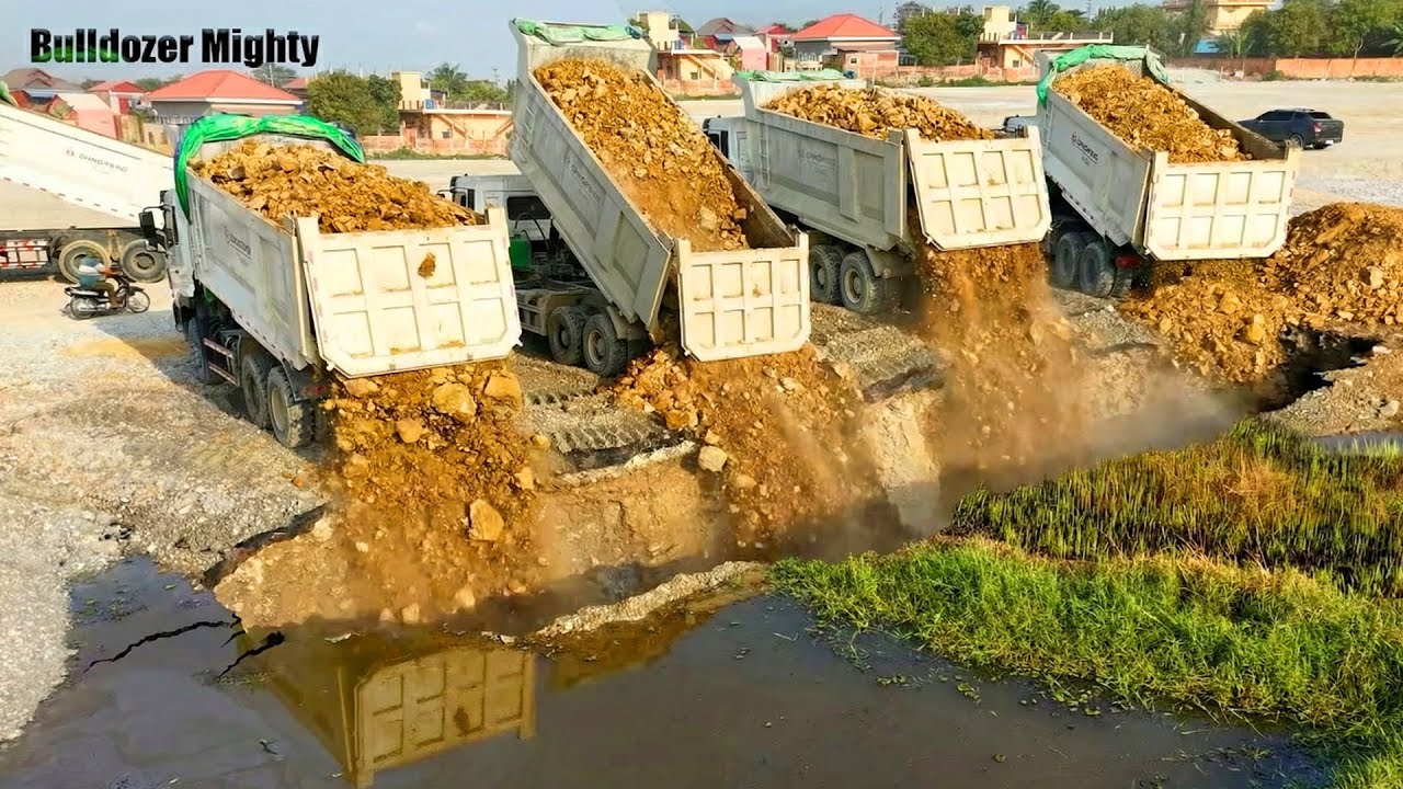Bulldozer SHANTUI Push Soil Bury Some Crack On The Land, Processing Filling Up The Land, Dump truck