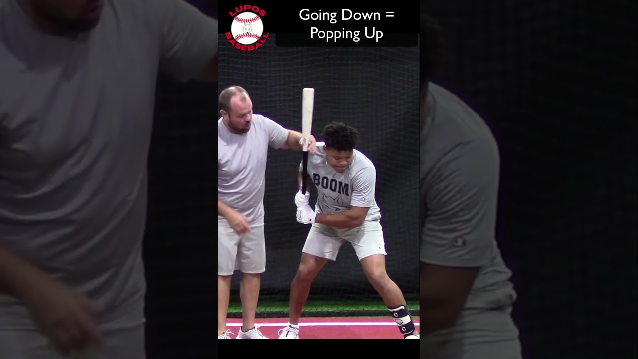 Going down to hit the low pitch = Pop Fly
