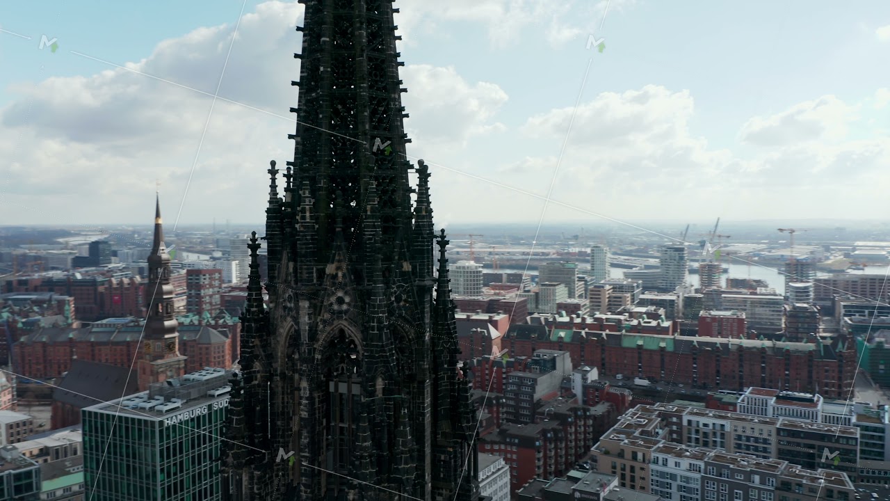 Close up aerial orbit of old gothic St Nikolai world war Memorial church ruins in Hamburg city