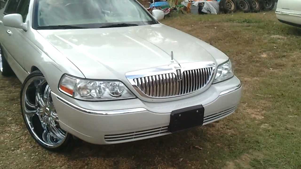 06 Lincoln Town Car on 26's and 81 Trans am on 22's