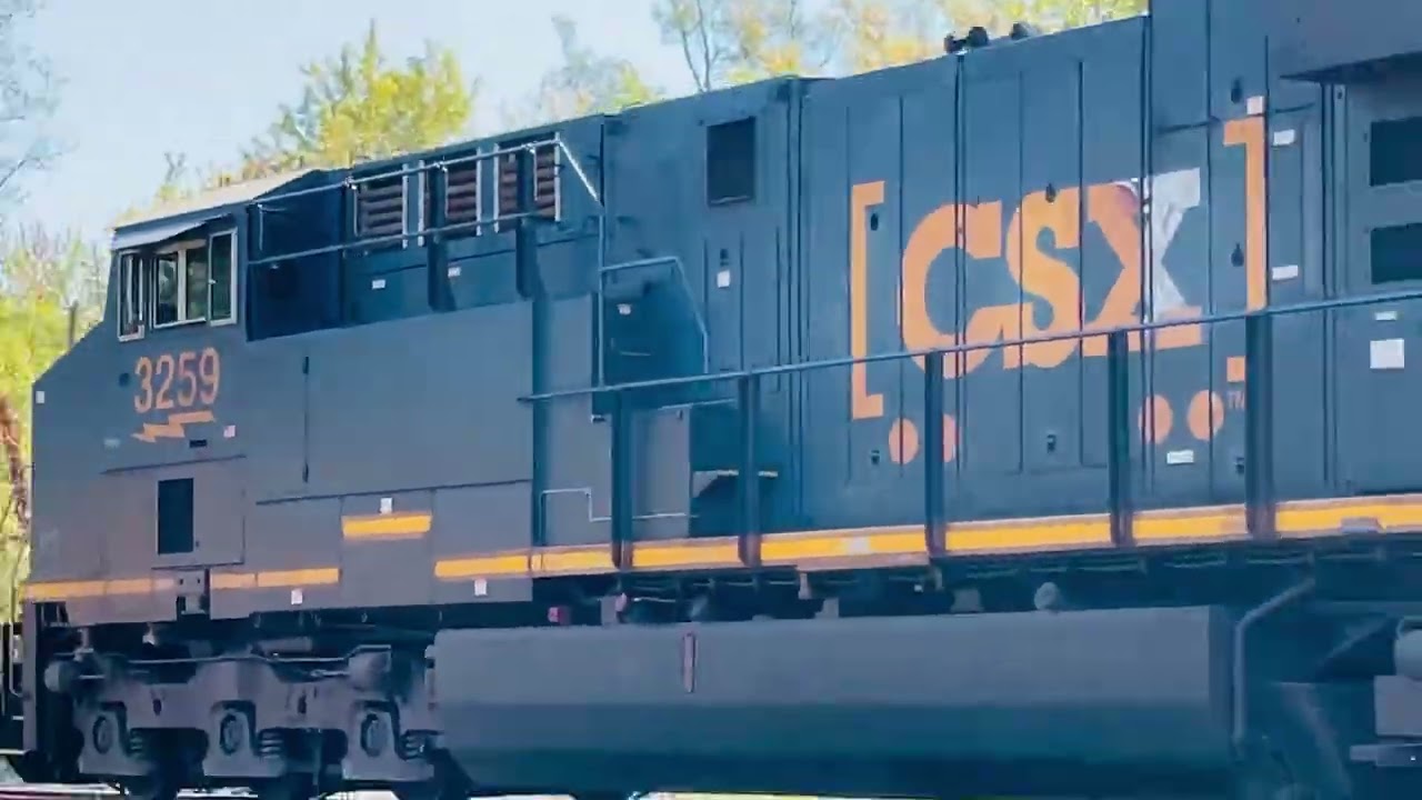 CSX 3259 leads a long eastbound freight through kirkville with a horn show