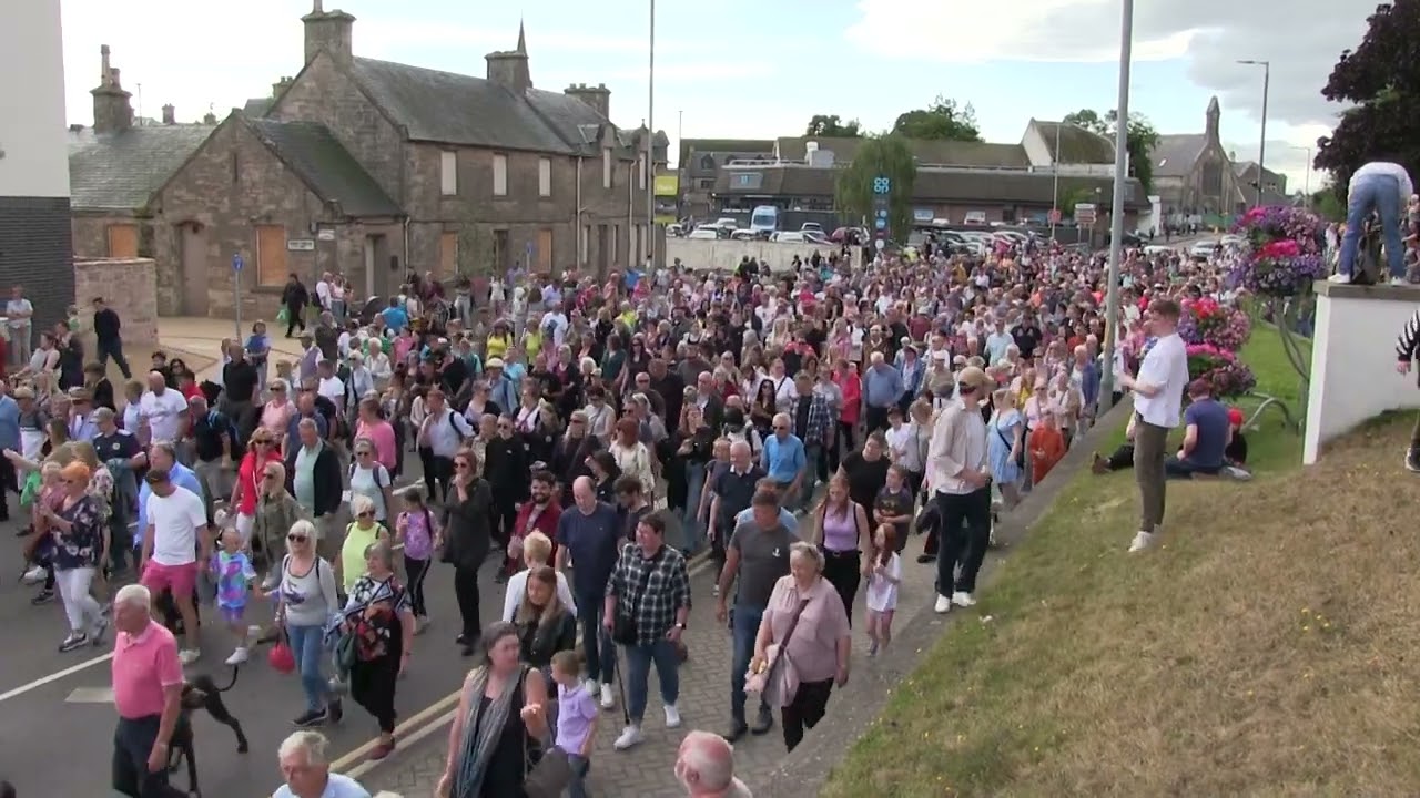 A tradition returns as the massed pipe bands march down to the Highland Games from Viewfield