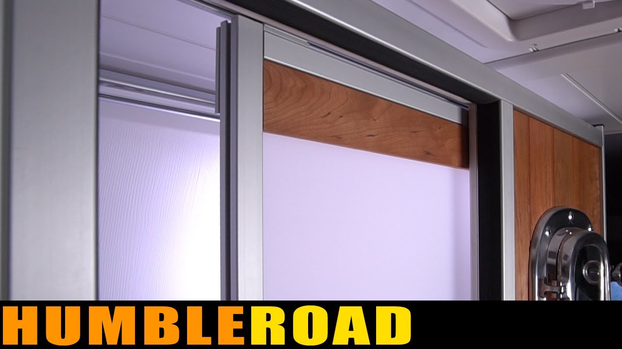 The remodeled SHOWER DOOR in this van is beautiful and functional. AND IT DOESN'T NEED A HANDLE!