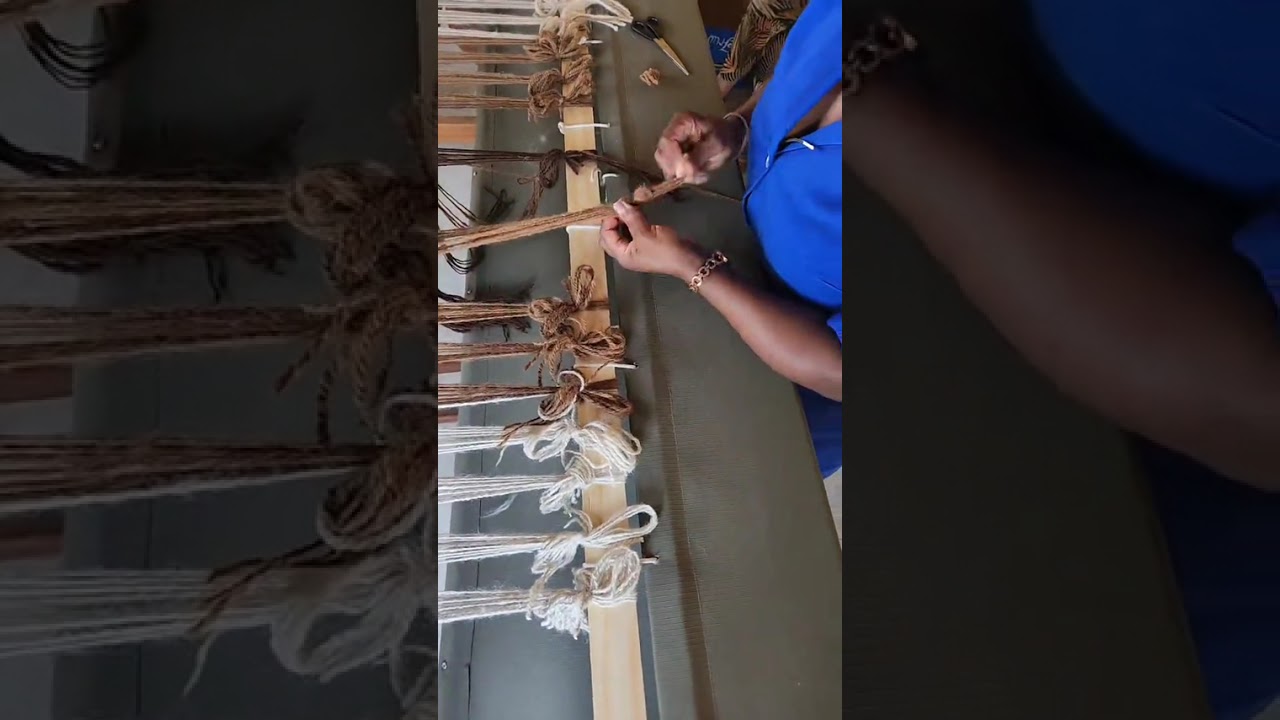 Sleying a floor loom with friends