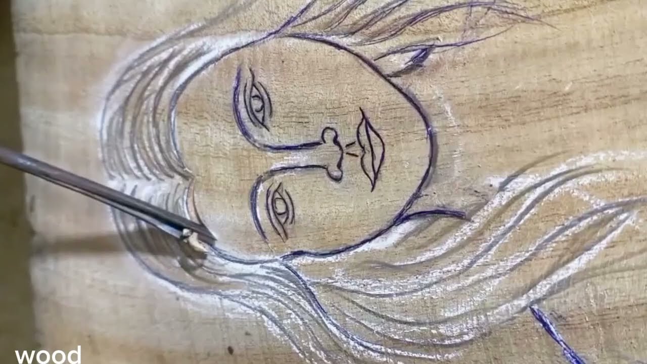 Carving a beautiful girl in wood