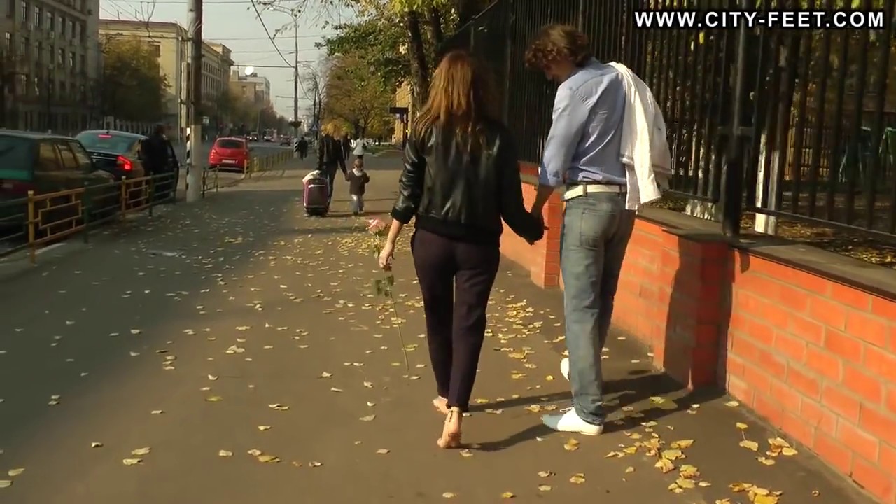 Barefoot Girl Walks in Streets with Her Boyfriend