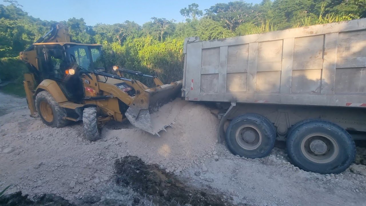 Skillful Backhoe Operator Pulls Stuck Truck from Mud FAST | Eastern St. Thomas