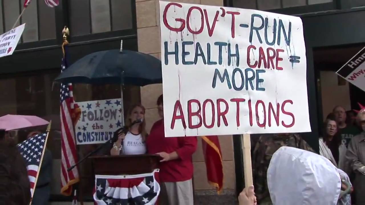 Tea Party protests taxes, endures rain