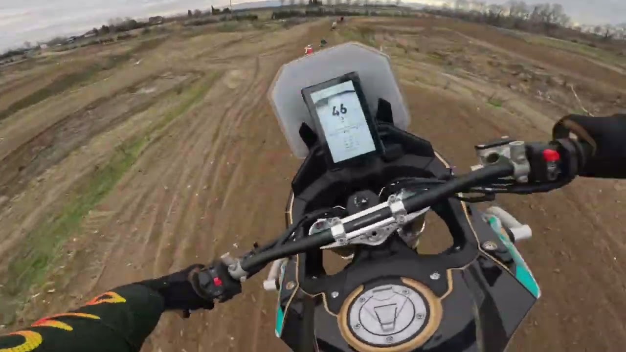 Kove 800x rally riding with Mx bikes on sandy track