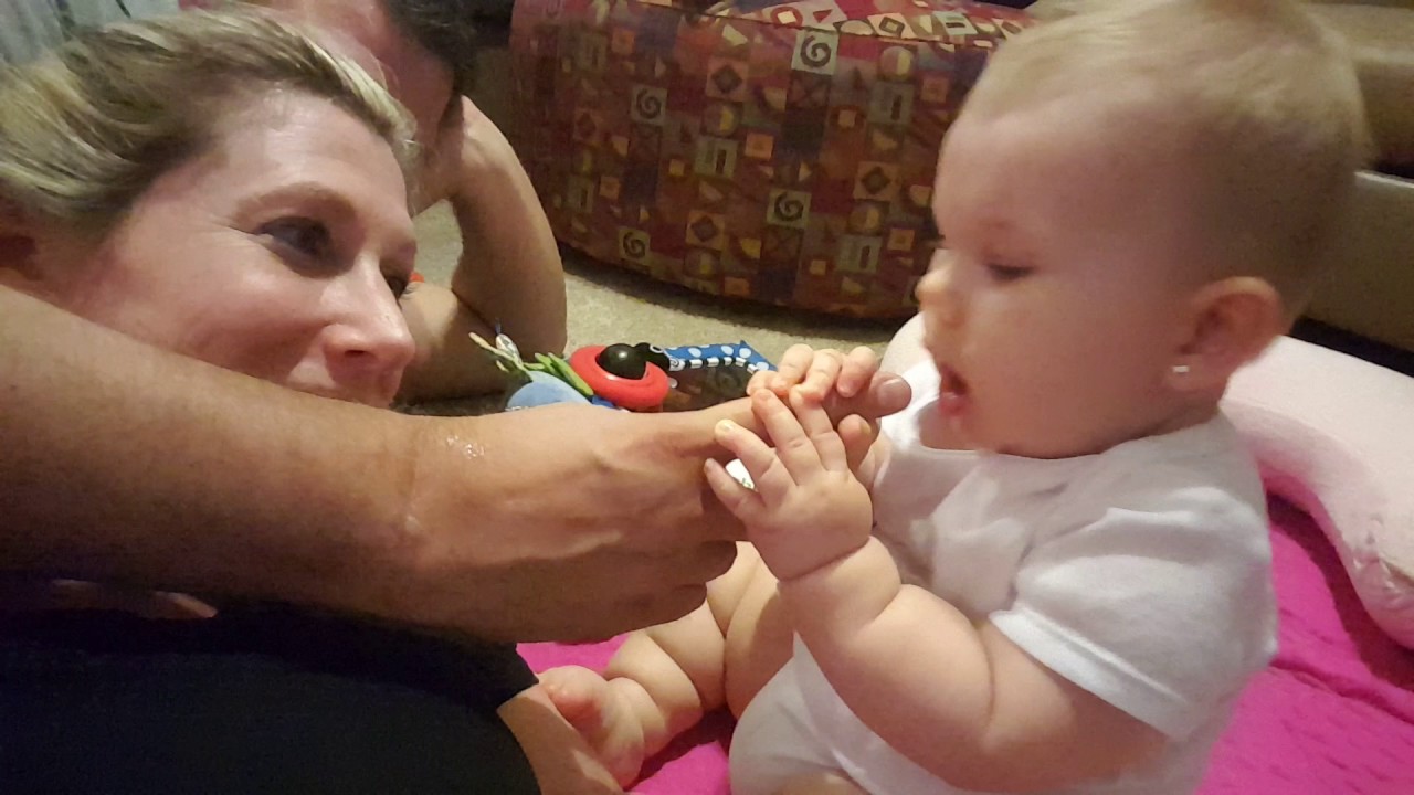 Baby Bites mommy's nose