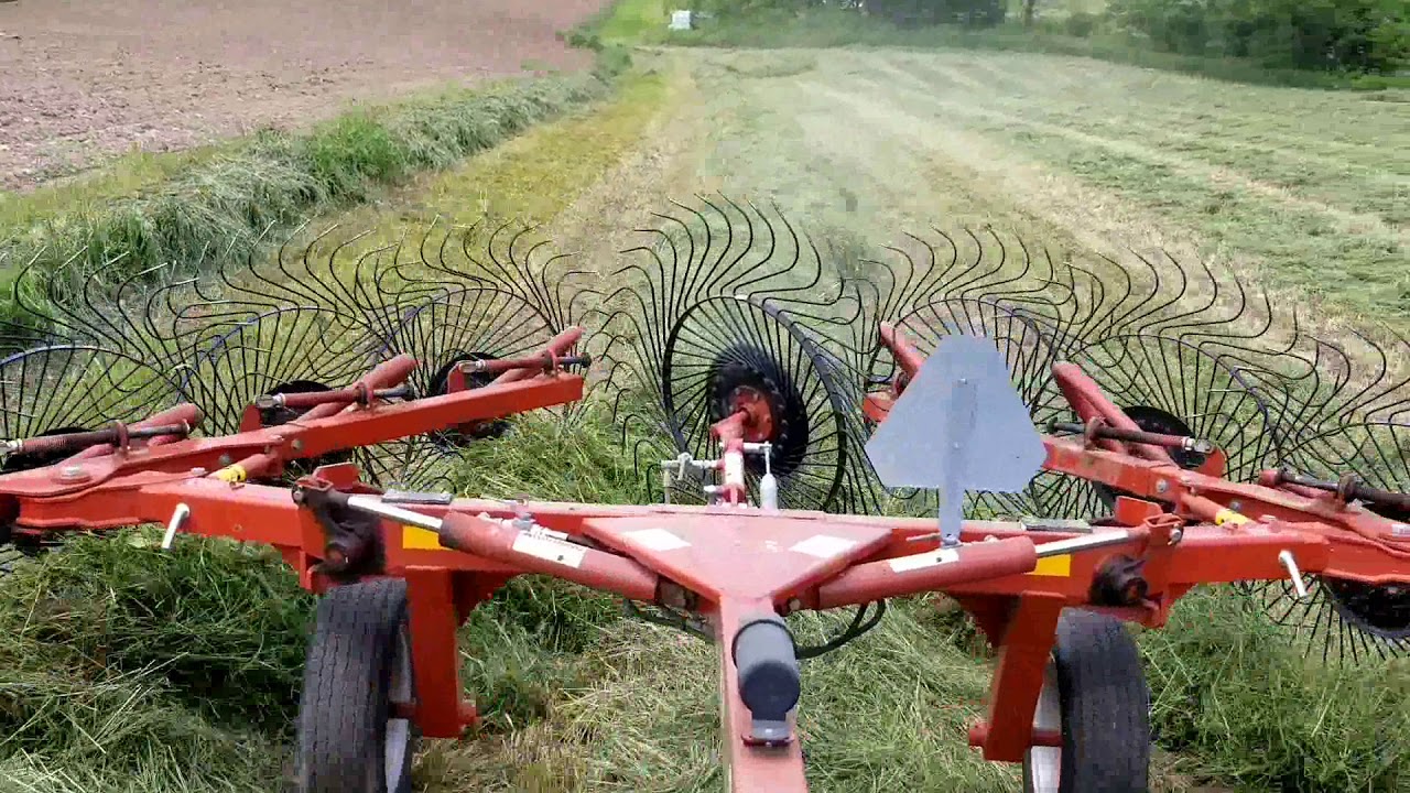 rakeing and wrapping hay (42 round bails of them 2)