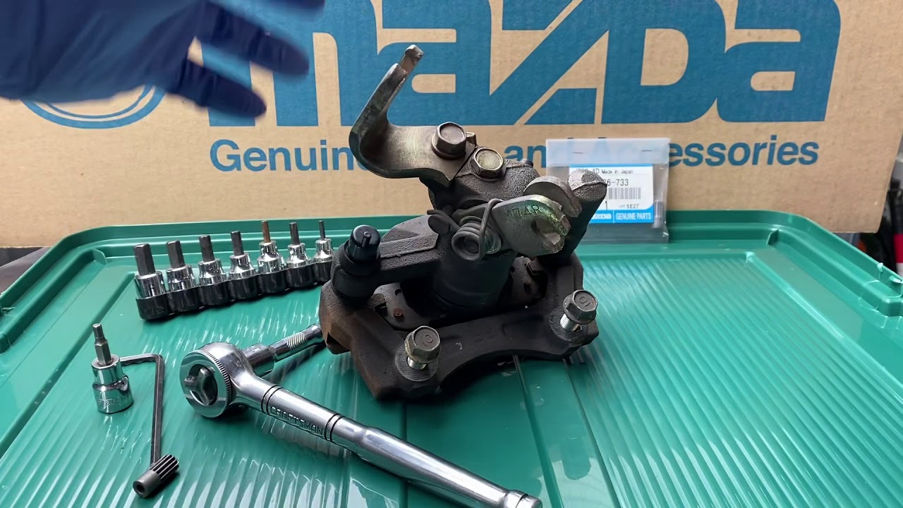 Пояснение к болту регулировки заднего суппорта Miata.