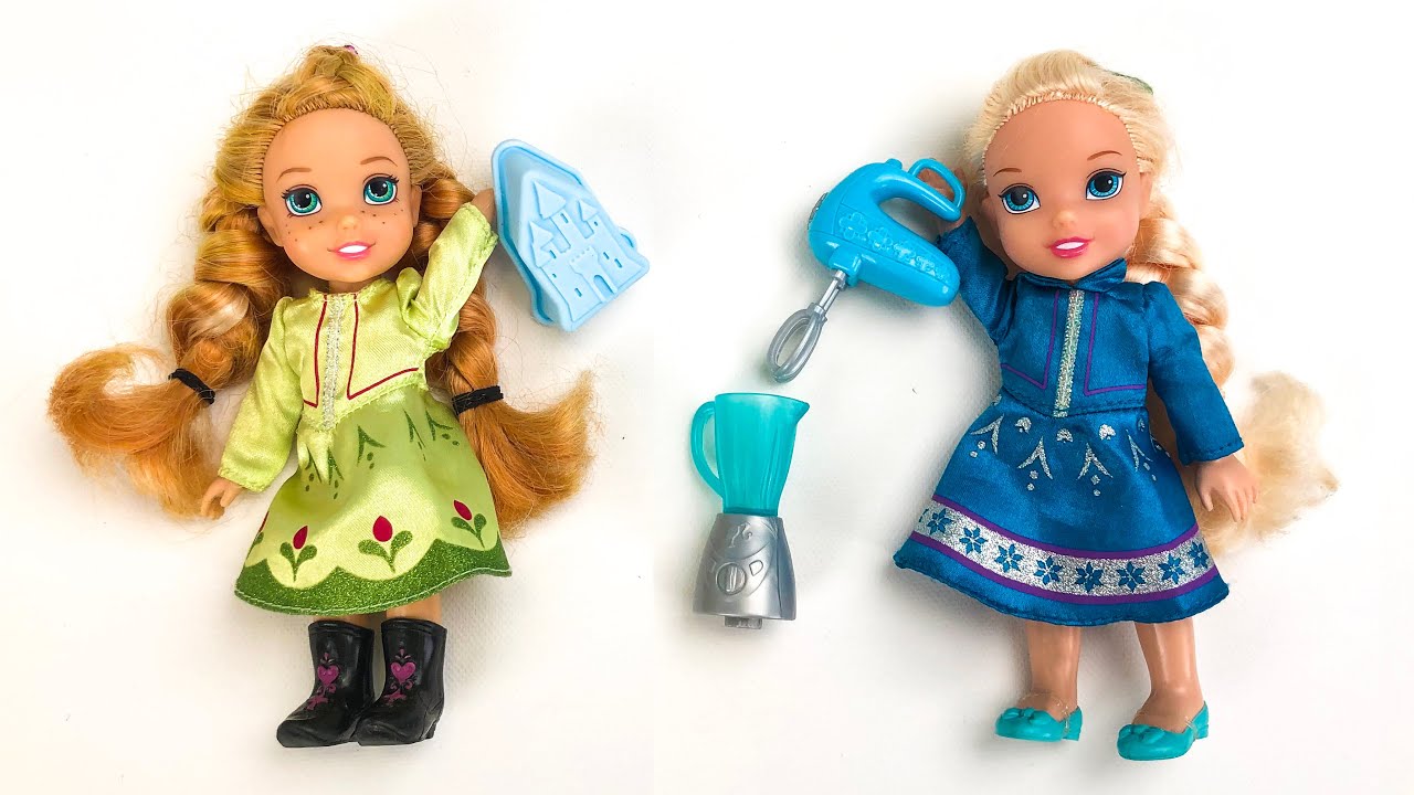 Elsa and Anna toddlers make a cake for Kristoff's birthday