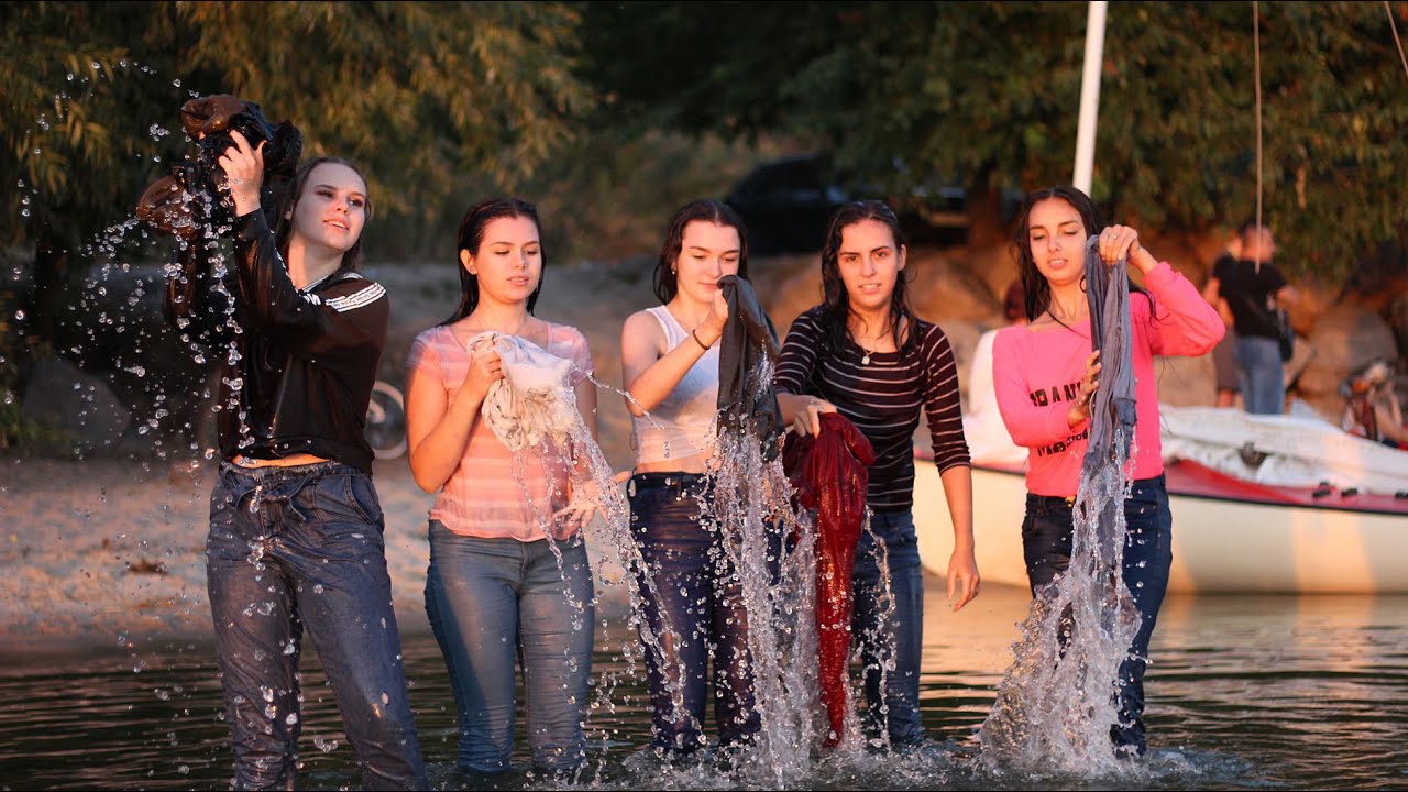 RIVER AT SUNSET: BEAUTIFUL GIRLS IN WET CLOTHES HAVE FUN BY THE RIVER [WETLOOKER ID: vk3674]