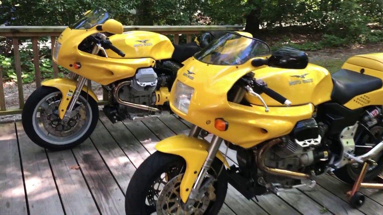 Two yellow 1997 Moto Guzzi 1100 Sport's with Staintune exhaust systems.